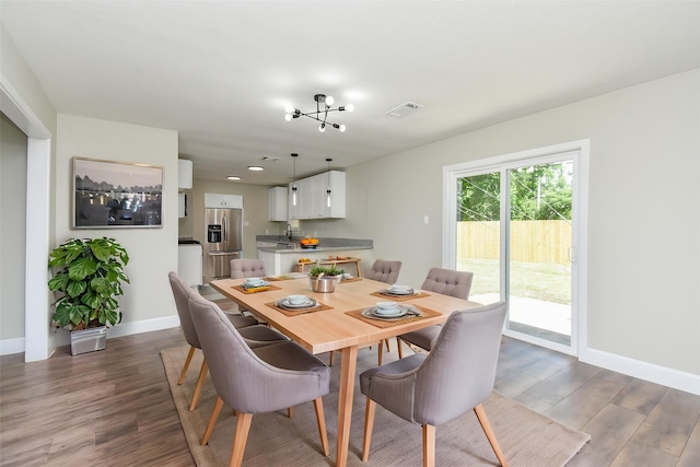 5906 Melanite Ave, Houston, TX 77053 - dining area featuring dark wood-style flooring, baseboards, and recessed lighting