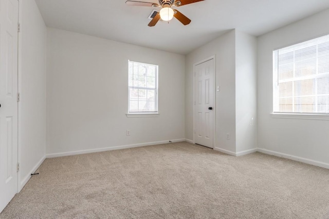 6626 Saint Augustine St, Houston, TX 77021 - unfurnished bedroom featuring light colored carpet, baseboards, and a ceiling fan