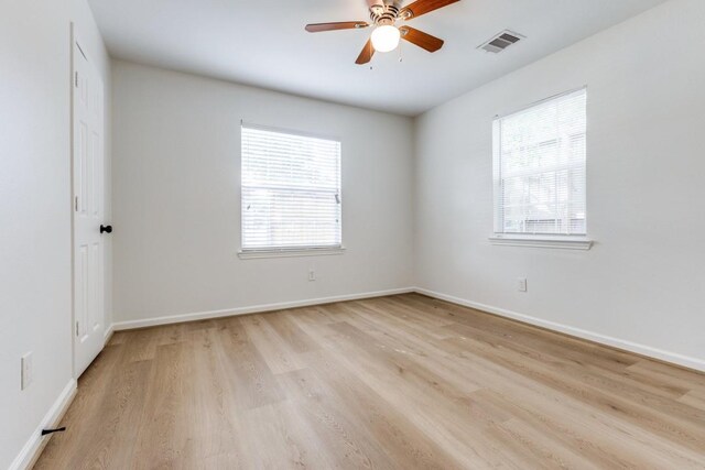 6626 Saint Augustine St, Houston, TX 77021 - spare room featuring light wood-type flooring, ceiling fan, and baseboards