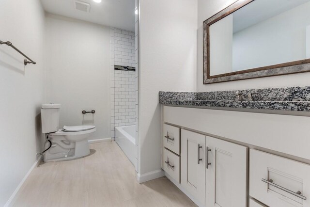 6626 Saint Augustine St, Houston, TX 77021 - bathroom featuring vanity, toilet, baseboards, and  shower combination