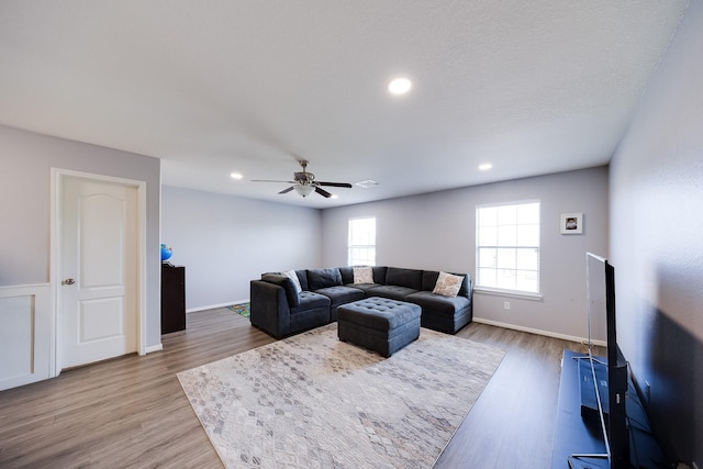 8106 Sweetstone Bluff Ln, Cypress, TX 77433 - living room featuring a ceiling fan, wood finished floors, recessed lighting, and baseboards