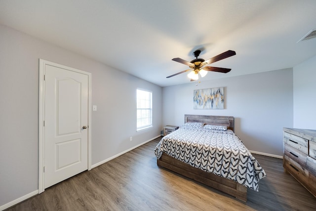 8106 Sweetstone Bluff Ln, Cypress, TX 77433 - bedroom with wood finished floors, baseboards, and ceiling fan