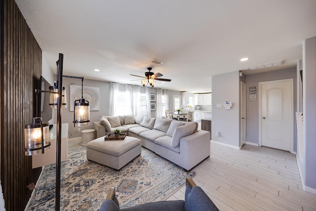 8106 Sweetstone Bluff Ln, Cypress, TX 77433 - living room featuring ceiling fan, baseboards, light wood-type flooring, and recessed lighting