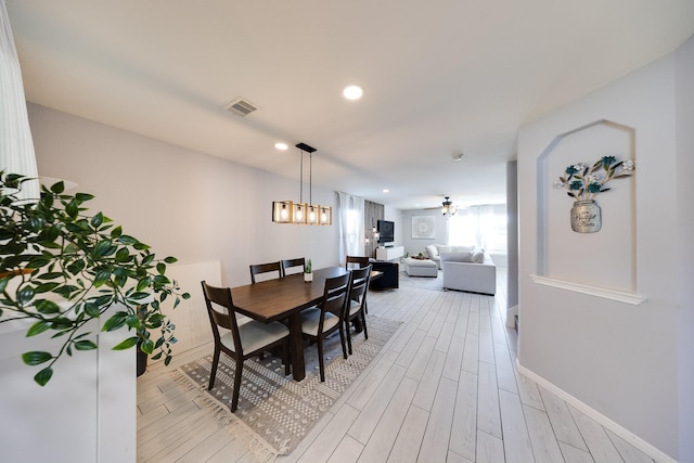 8106 Sweetstone Bluff Ln, Cypress, TX 77433 - dining area with light wood-type flooring, recessed lighting, baseboards, and a chandelier