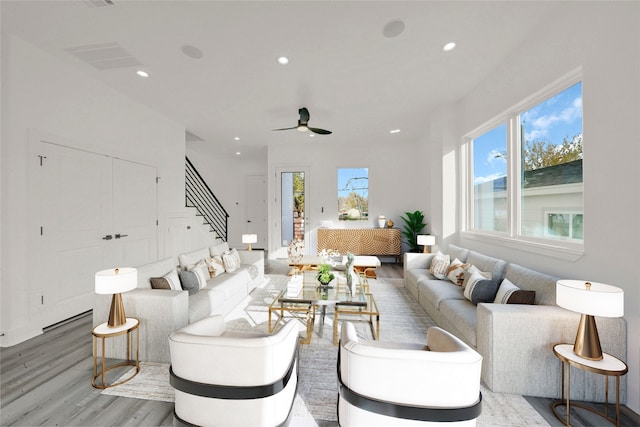 4404 Bond St, Houston, TX 77026 - living area featuring wood finished floors, stairway, recessed lighting, and ceiling fan