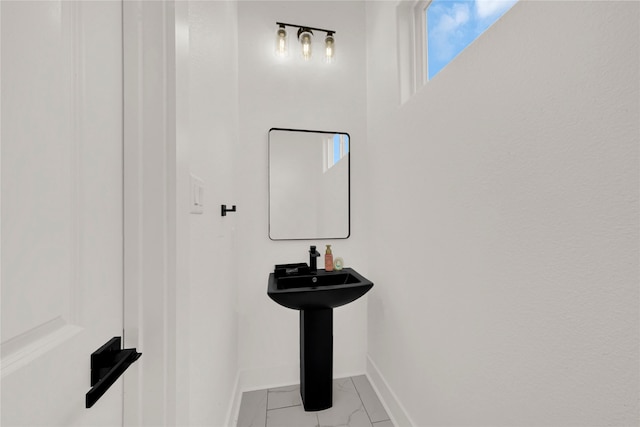 4404 Bond St, Houston, TX 77026 - bathroom with baseboards and marble finish floors