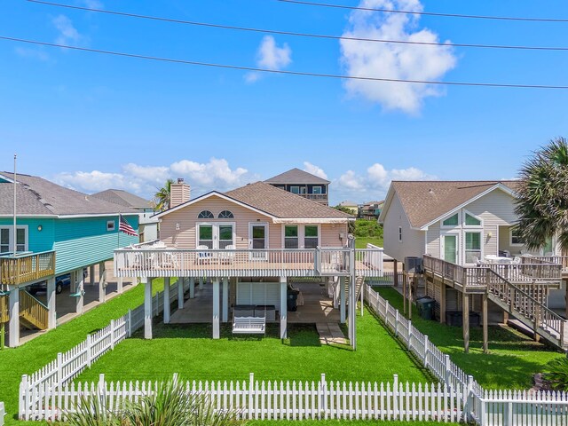 22321 Vista Del Mar, Galveston, TX 77554 - rear view of property with a wooden deck, a chimney, and stairs