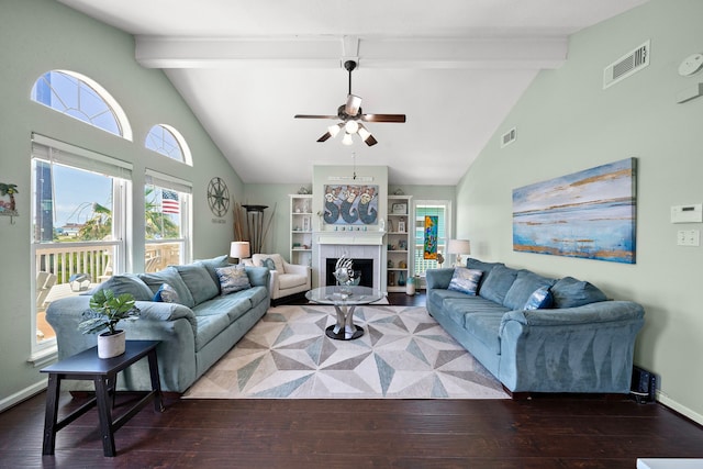 22321 Vista Del Mar, Galveston, TX 77554 - living area featuring a ceiling fan, beam ceiling, wood finished floors, high vaulted ceiling, and a tile fireplace