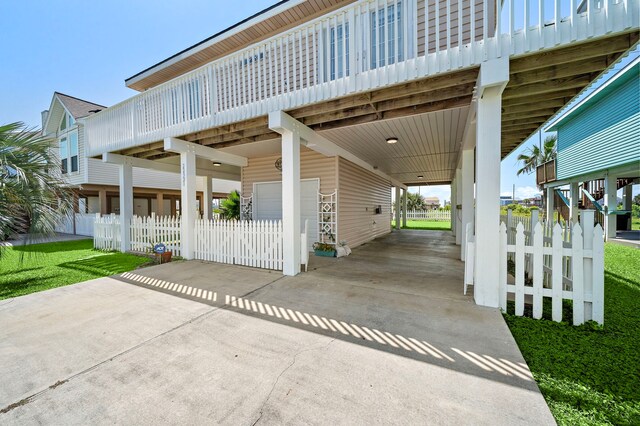 22321 Vista Del Mar, Galveston, TX 77554 - view of patio featuring a garage and concrete driveway