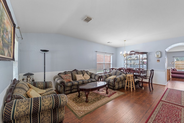 16310 Autumn Leigh Dr, Houston, TX 77083 - living area with a chandelier, dark wood-style floors, arched walkways, and vaulted ceiling