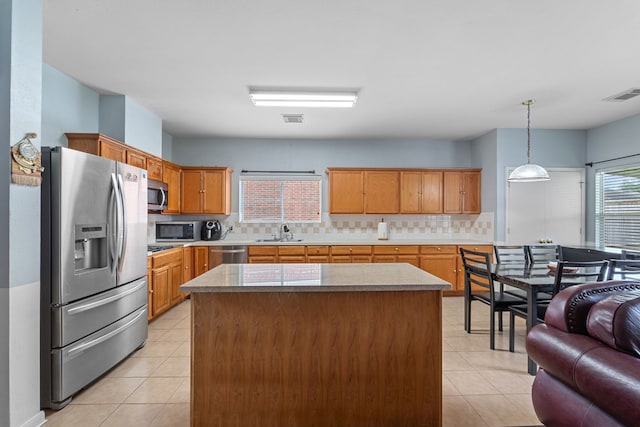 16310 Autumn Leigh Dr, Houston, TX 77083 - kitchen with appliances with stainless steel finishes, a sink, light tile patterned floors, and tasteful backsplash