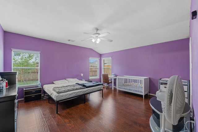 16310 Autumn Leigh Dr, Houston, TX 77083 - bedroom with multiple windows, vaulted ceiling, wood finished floors, and a ceiling fan