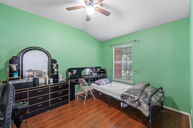 16310 Autumn Leigh Dr, Houston, TX 77083 - bedroom with vaulted ceiling, dark wood-style flooring, a ceiling fan, and baseboards