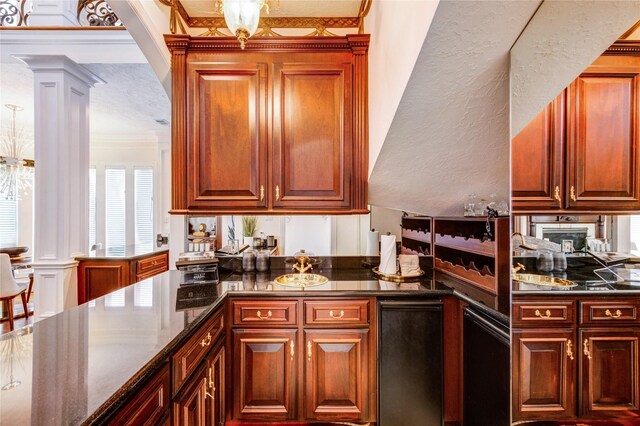 5302 Val Verde St, Houston, TX 77056 - kitchen with crown molding, dark stone counters, decorative columns, and a peninsula