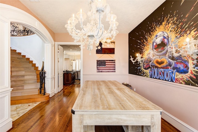 5302 Val Verde St, Houston, TX 77056 - dining space with a chandelier, wood finished floors, and stairs
