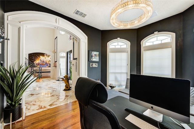 5302 Val Verde St, Houston, TX 77056 - office space featuring marble look tile flooring, a chandelier, healthy amount of natural light, and a textured ceiling
