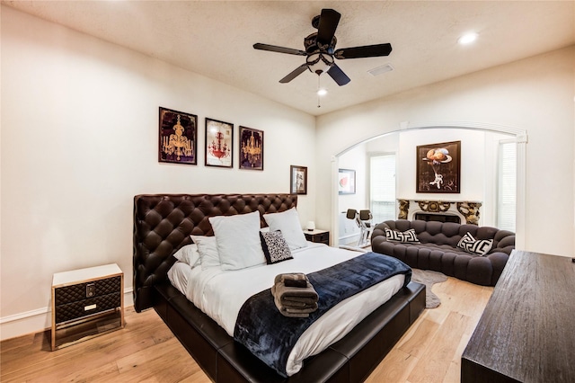5302 Val Verde St, Houston, TX 77056 - bedroom featuring arched walkways, light wood finished floors, recessed lighting, and ceiling fan