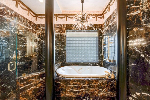 5302 Val Verde St, Houston, TX 77056 - bathroom featuring a garden tub, a marble finish shower, and a chandelier