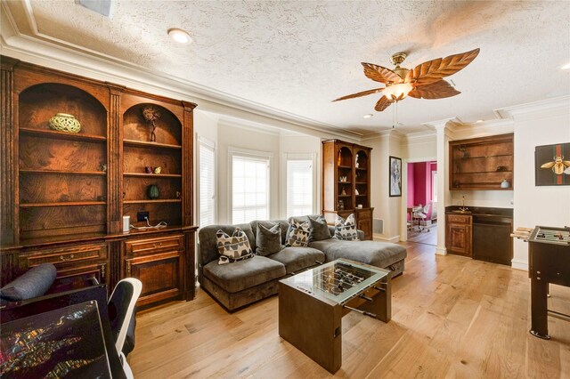 5302 Val Verde St, Houston, TX 77056 - living room with ceiling fan, light wood finished floors, crown molding, a textured ceiling, and recessed lighting