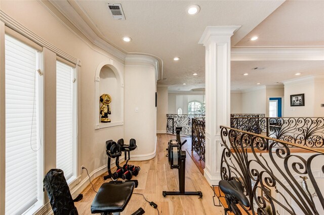 5302 Val Verde St, Houston, TX 77056 - exercise room featuring light wood-type flooring, crown molding, recessed lighting, baseboards, and ornate columns