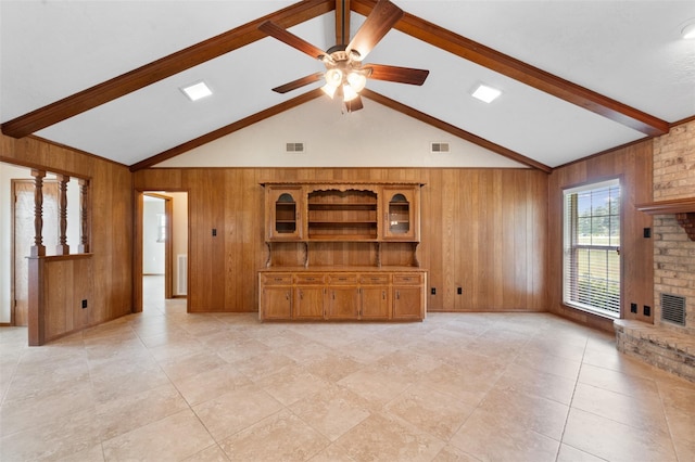 534 W Hufsmith Rd, Tomball, TX 77375 - unfurnished living room featuring wooden walls, a ceiling fan, a fireplace, and light tile patterned floors