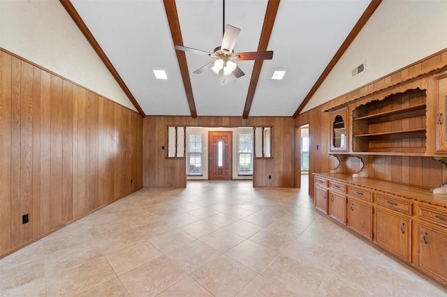 534 W Hufsmith Rd, Tomball, TX 77375 - unfurnished living room featuring wood walls and a ceiling fan