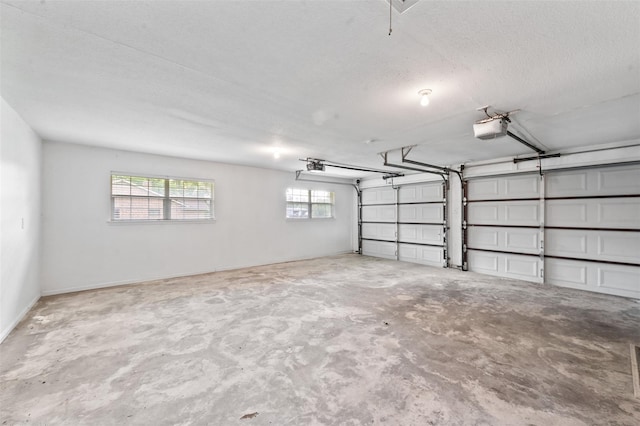 534 W Hufsmith Rd, Tomball, TX 77375 - garage featuring a garage door opener