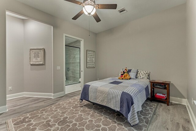 21603 Fairhaven Creek Dr, Cypress, TX 77433 - bedroom with wood finished floors, baseboards, and ceiling fan