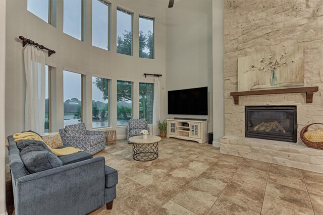 21603 Fairhaven Creek Dr, Cypress, TX 77433 - living area featuring a towering ceiling, plenty of natural light, and a fireplace