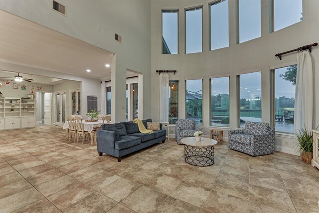 21603 Fairhaven Creek Dr, Cypress, TX 77433 - living area featuring ceiling fan and a towering ceiling