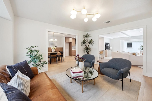 4411 Colchester St, Houston, TX 77018 - living room with a chandelier and light wood-type flooring