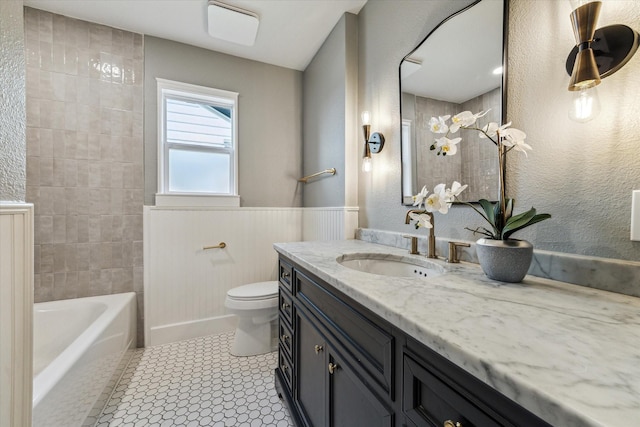 4411 Colchester St, Houston, TX 77018 - full bath with vanity, toilet, wainscoting, and shower / washtub combination