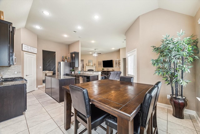4914 Mountain Maple Trl, Rosenberg, TX 77471 - dining room featuring light tile patterned floors, recessed lighting, a ceiling fan, baseboards, and vaulted ceiling