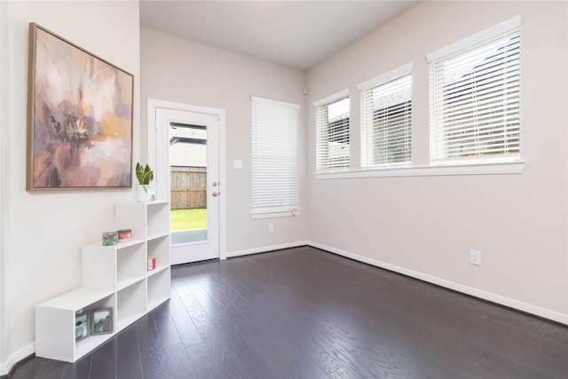 7334 Lake Arrowhead Ln, Porter, TX 77365 - entryway with dark wood-type flooring and baseboards
