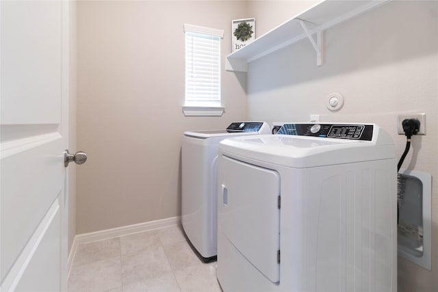 7334 Lake Arrowhead Ln, Porter, TX 77365 - washroom with washing machine and dryer and baseboards