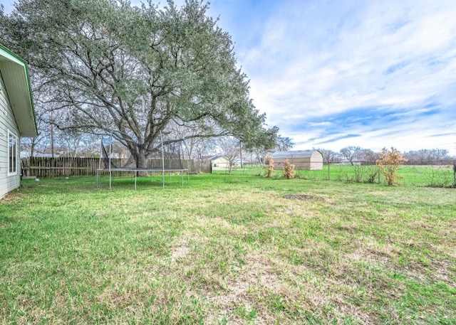 701 Alamo St, El Campo, TX 77437 - view of yard with a trampoline
