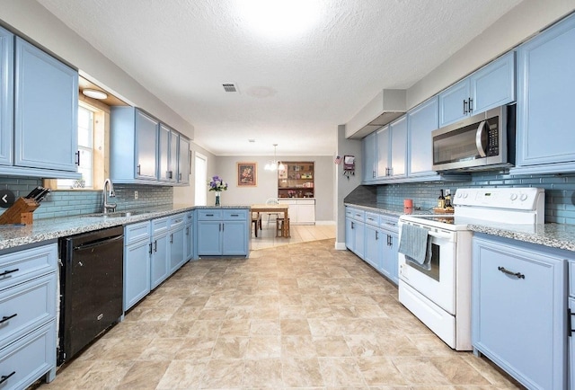 701 Alamo St, El Campo, TX 77437 - kitchen with stainless steel microwave, electric stove, black dishwasher, blue cabinets, and a sink
