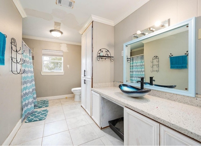 701 Alamo St, El Campo, TX 77437 - bathroom featuring ornamental molding, toilet, baseboards, vanity, and tile patterned floors