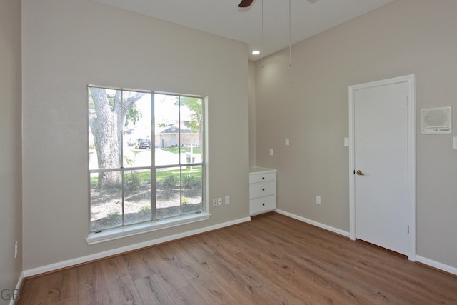 918 Longview Dr, Sugar Land, TX 77478 - unfurnished room with wood finished floors, baseboards, and a ceiling fan