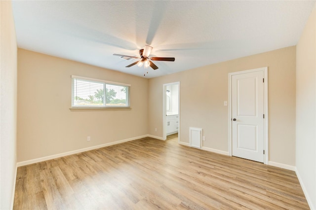 2525 29th Ave N, Texas City, TX 77590 - unfurnished room featuring light wood finished floors, a ceiling fan, and baseboards