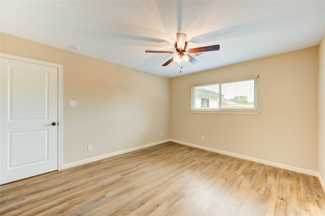 2525 29th Ave N, Texas City, TX 77590 - spare room featuring a ceiling fan, light wood-style floors, and baseboards