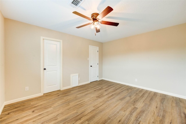 2525 29th Ave N, Texas City, TX 77590 - empty room featuring light wood-type flooring, ceiling fan, and baseboards