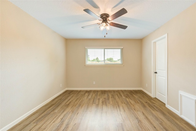 2525 29th Ave N, Texas City, TX 77590 - spare room featuring light wood-type flooring, ceiling fan, and baseboards