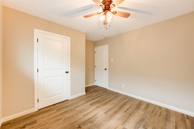 2525 29th Ave N, Texas City, TX 77590 - unfurnished bedroom with light wood-style flooring, baseboards, and ceiling fan