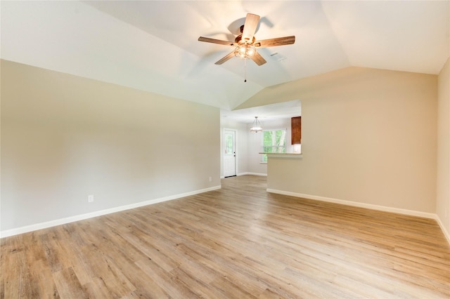 2525 29th Ave N, Texas City, TX 77590 - unfurnished living room featuring a ceiling fan, light wood-style flooring, vaulted ceiling, and baseboards
