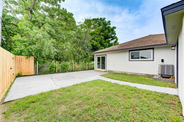 2525 29th Ave N, Texas City, TX 77590 - view of yard featuring central AC and a patio area