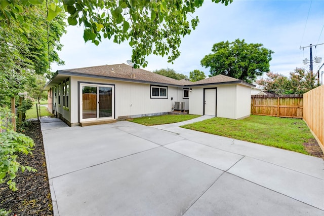 2525 29th Ave N, Texas City, TX 77590 - back of house featuring a patio area, cooling unit, and a shingled roof