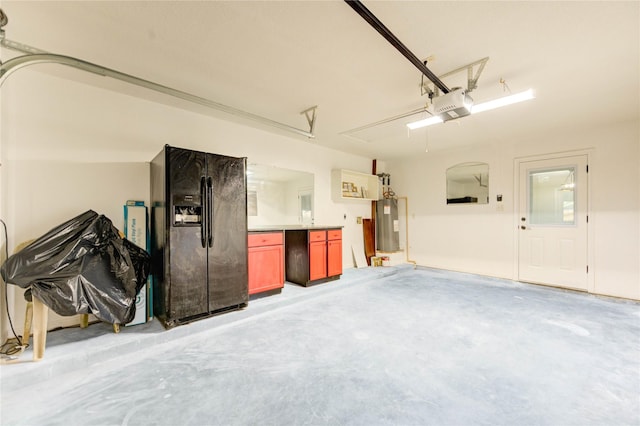 2525 29th Ave N, Texas City, TX 77590 - garage with black fridge, water heater, and a garage door opener