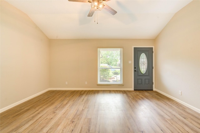 2525 29th Ave N, Texas City, TX 77590 - foyer with vaulted ceiling, light wood-style flooring, a ceiling fan, and baseboards
