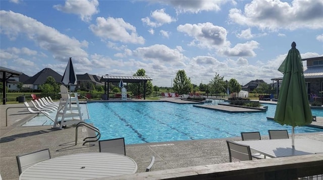 1007 Parsnip Acres Ct, Richmond, TX 77406 - community pool with a patio area and outdoor dining area